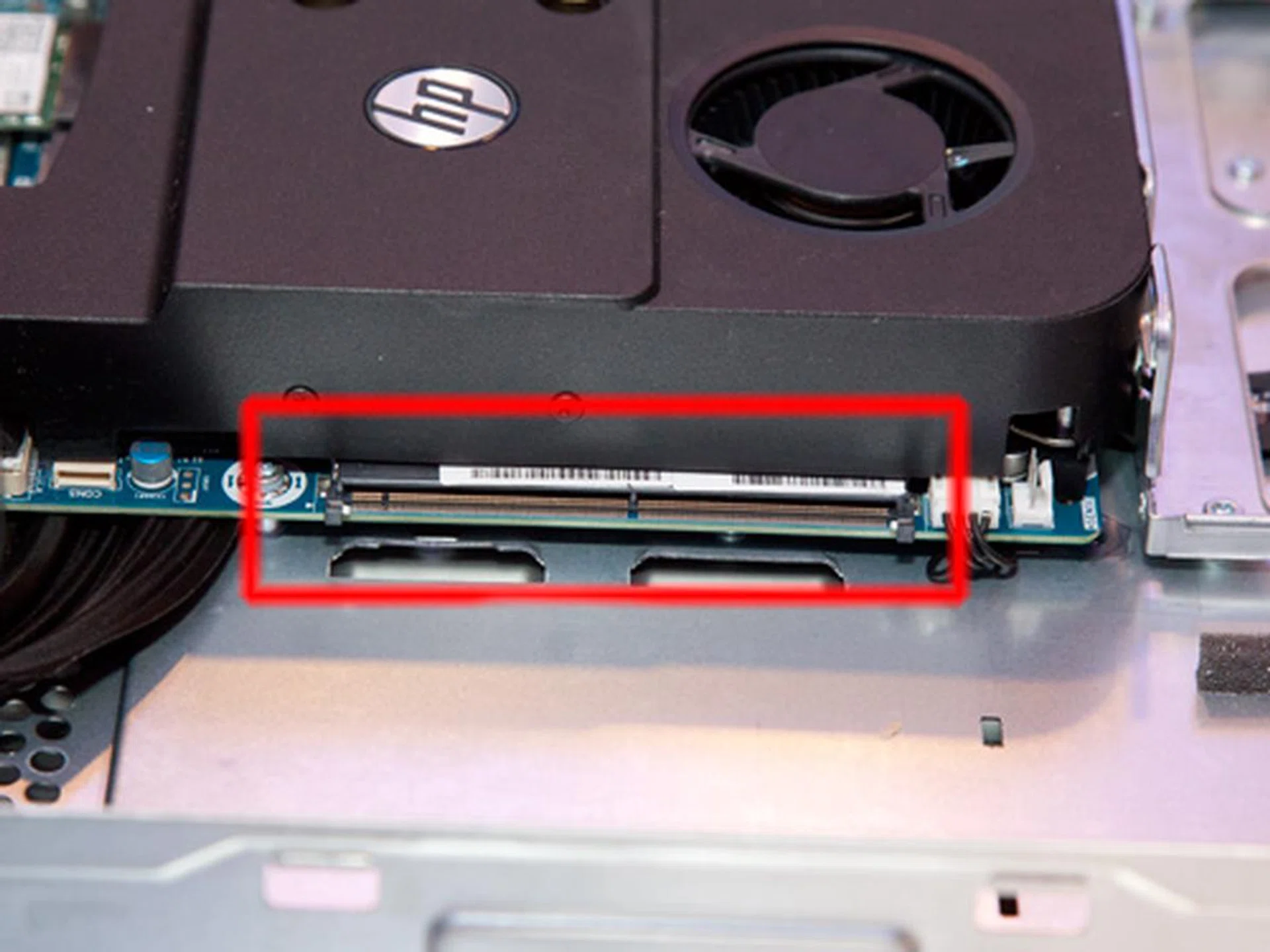 The specially designed graphics card slot on the motherboard lets you install the card similar to how you would install a memory module in a laptop computer. The design lets the user lift the card out of the system instead of tugging and pulling it out of the slot, like in a regular desktop system.