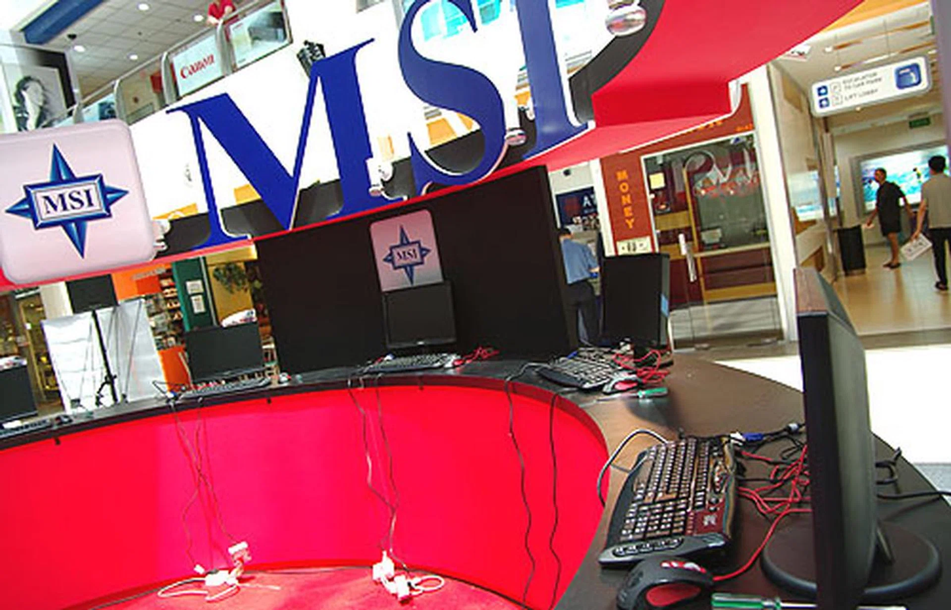  The contestants are split into two groups of five, with each half of the venue dedicated for each group. Here's the red half of the work area allocated for them. As you can see, the monitors, keyboards and mice have been arranged to delineate the separate areas for each contestant.  