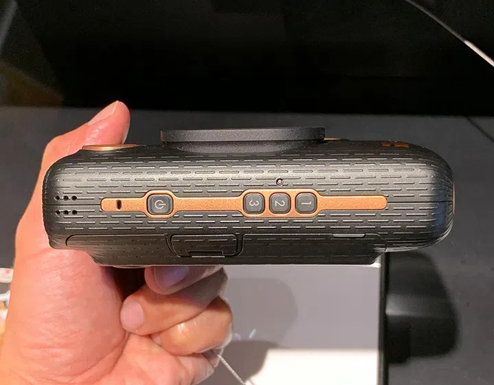 The power button and three frame shortcuts are located along one side.