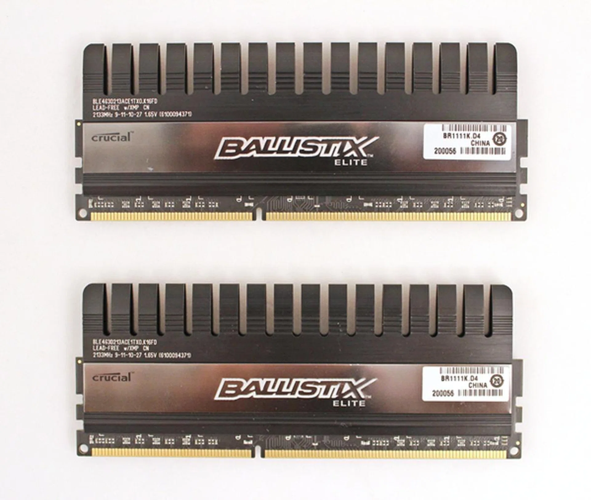 The Crucial Ballistic Elite Series memory modules appear to have their black heat spreaders extending from their black PCB.