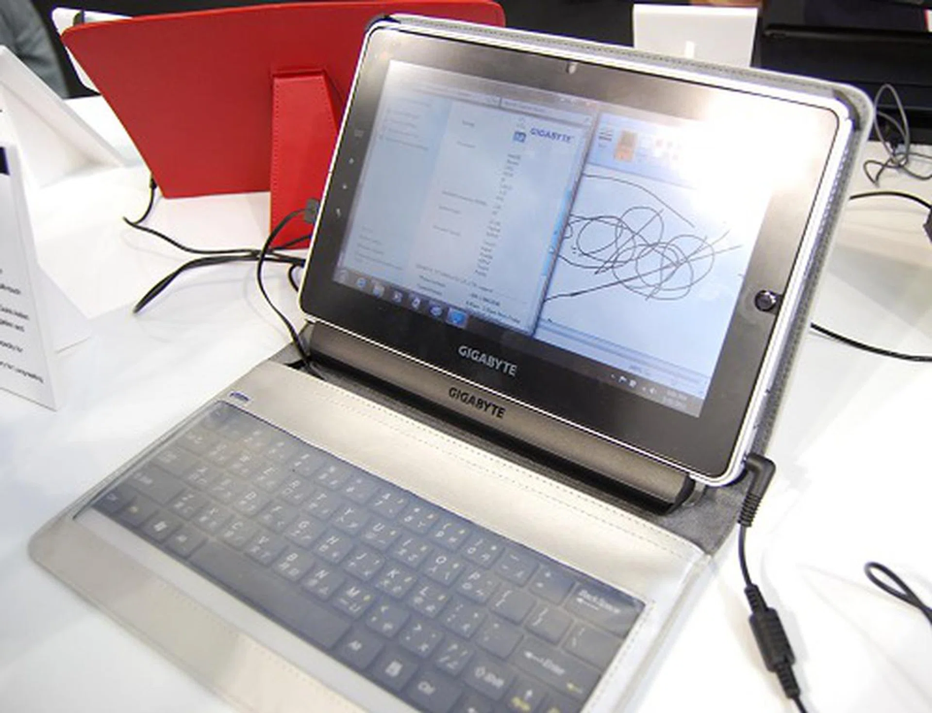 The S1080 is a Windows 7 based tablet running the Intel Atom platform. It has a capacitive multi-touch screen, optical finger navigation and mouse buttons, extended battery life option and will retail around the S$800 to S$900 depending on the configuration. Competition will certainly be stiff.