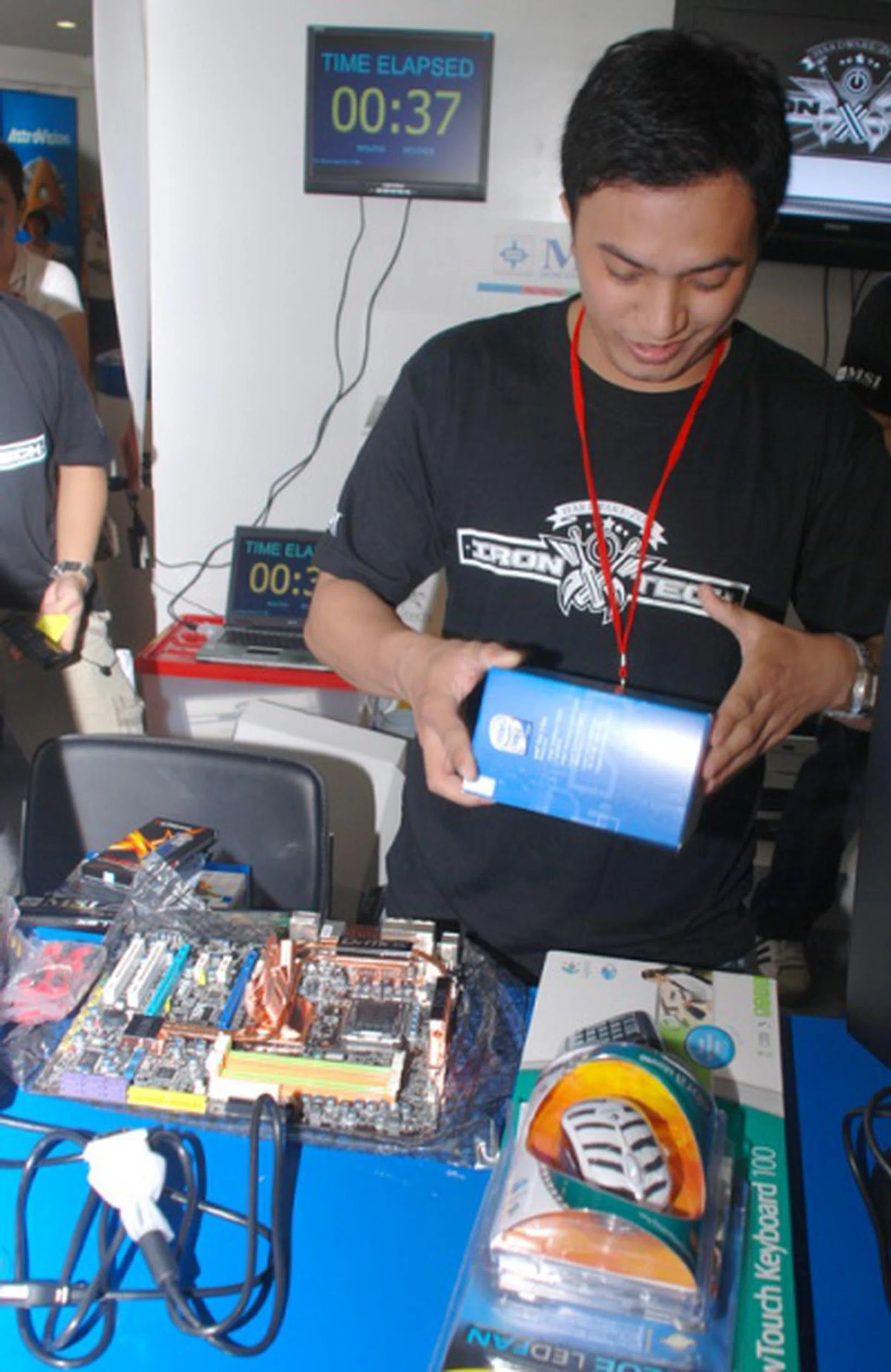  Here's Jomar Marfil much earlier in the competition as he was ripping through the packaging of the components. Seen in the background is our Timer application putting the pressure on the contestants.  