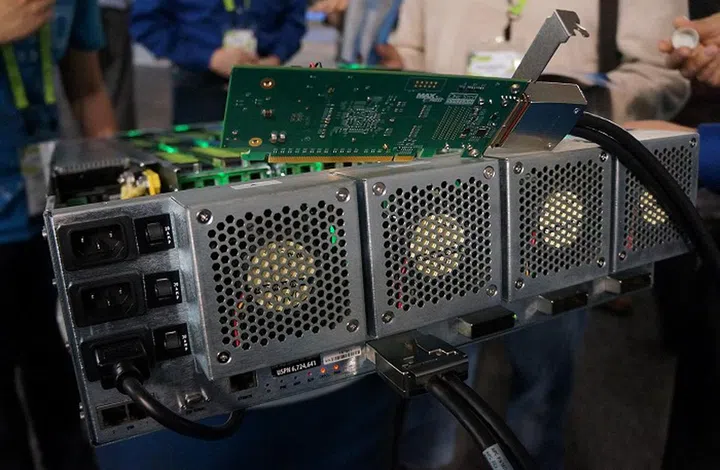 This is the back view of One Stop System's HDCA appliance. You'll notice the triple stacked 3000-watt redundant PSUs, the powerful exhaust fans and of course the PCIe x16 Gen.3 connectivity to the host machine(s) via the adapter cards.