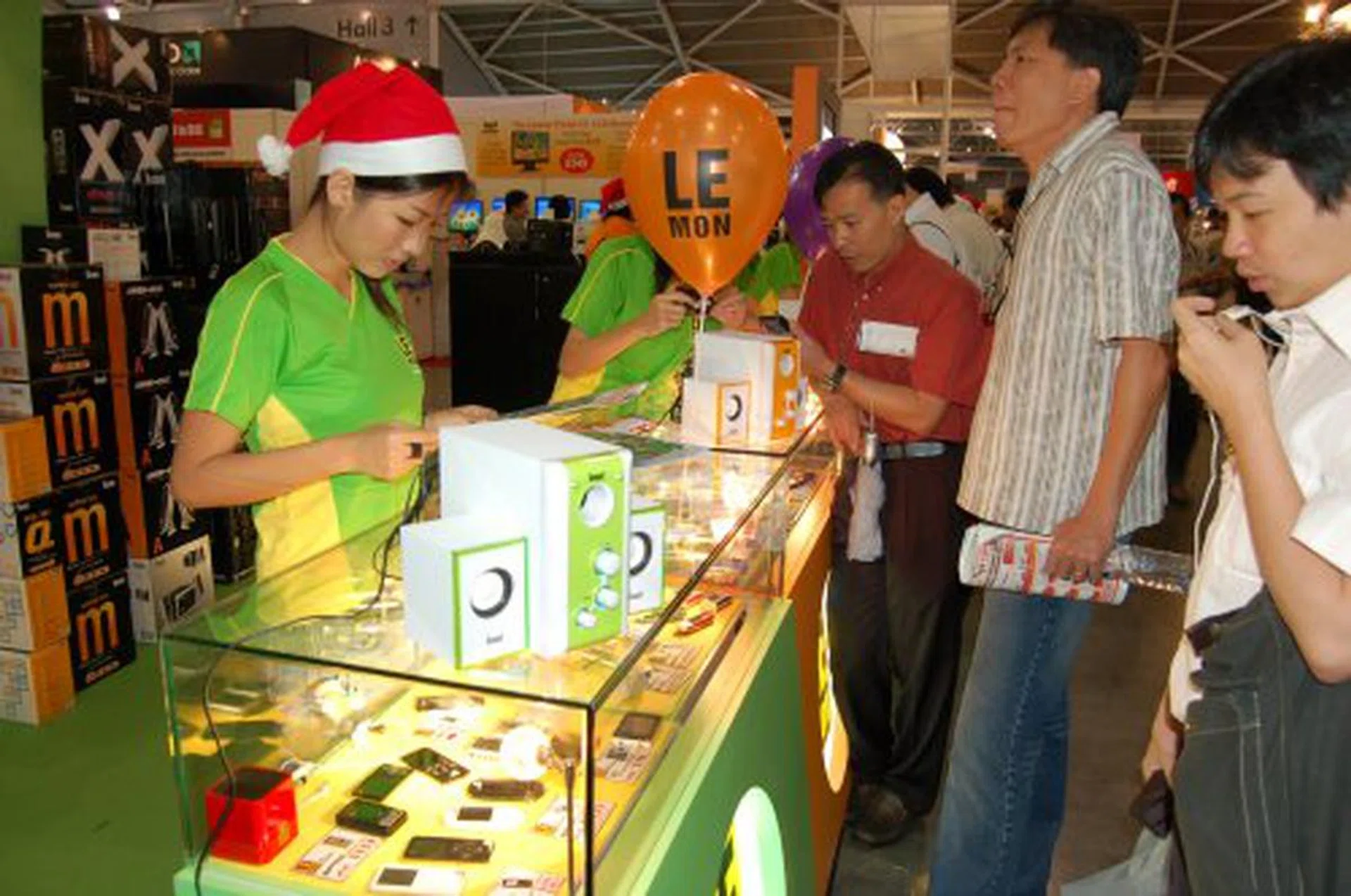 The Le-MON booth at Sitex offering a variety of mp3 players and speaker systems.