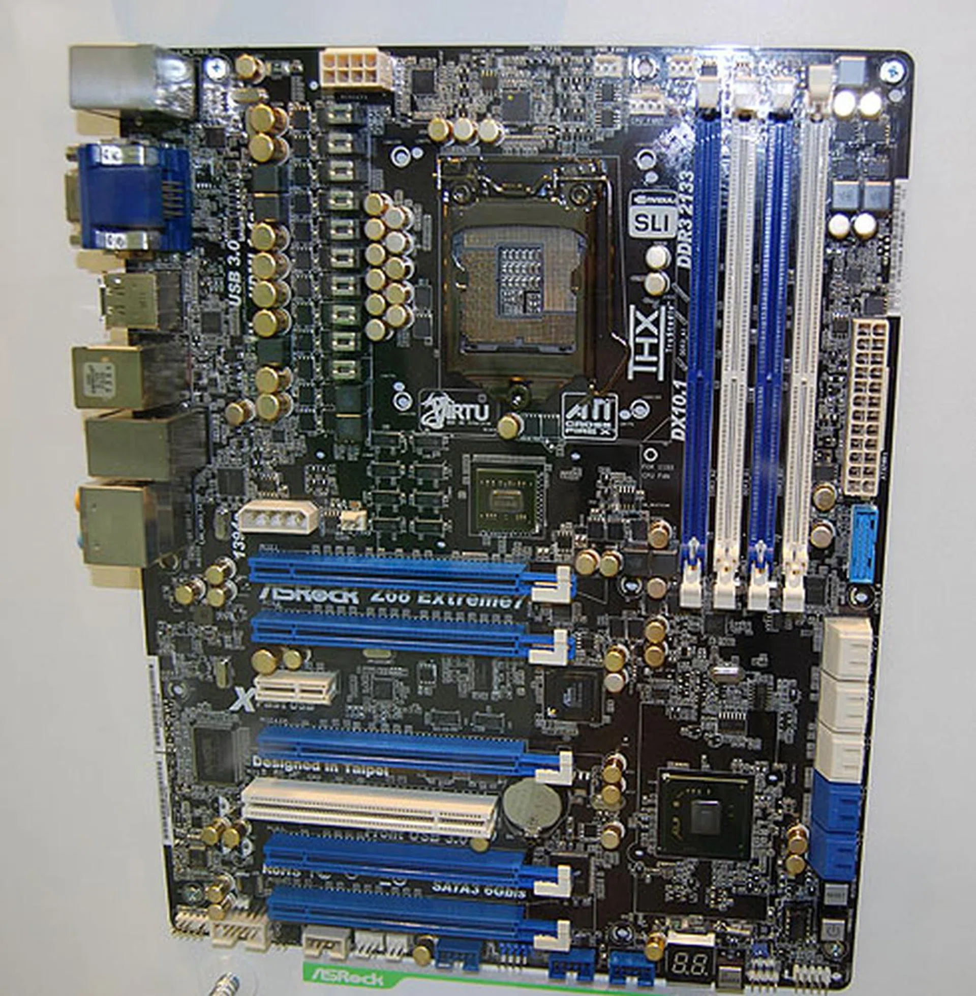 ASRock's Extreme7 version of the Z68 chipset is without a doubt ASRock's highest end offering for this chipset. It has five PCIe 2.0 slots with support for quad CrossFireX and SLI. It also has a whopping four display outputs, including DisplayPort. Along with up to 6 USB 3.0 ports, this is one high-end board.