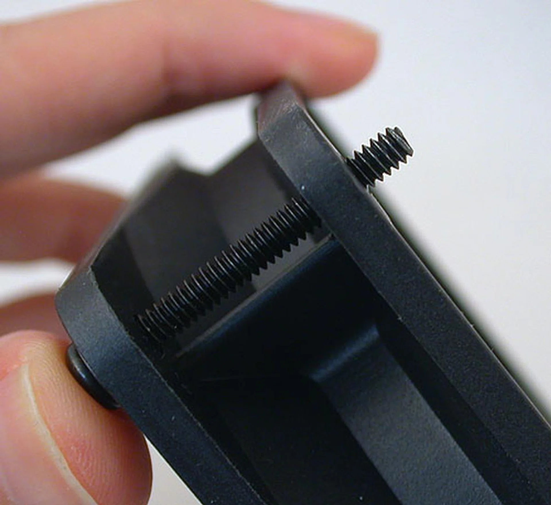 You'll have to screw the cooler fan and the radiator together to the chassis using the same set of four screws. While they may be longer than usual, this is the allowance you get for the radiator after passing through the fan. 