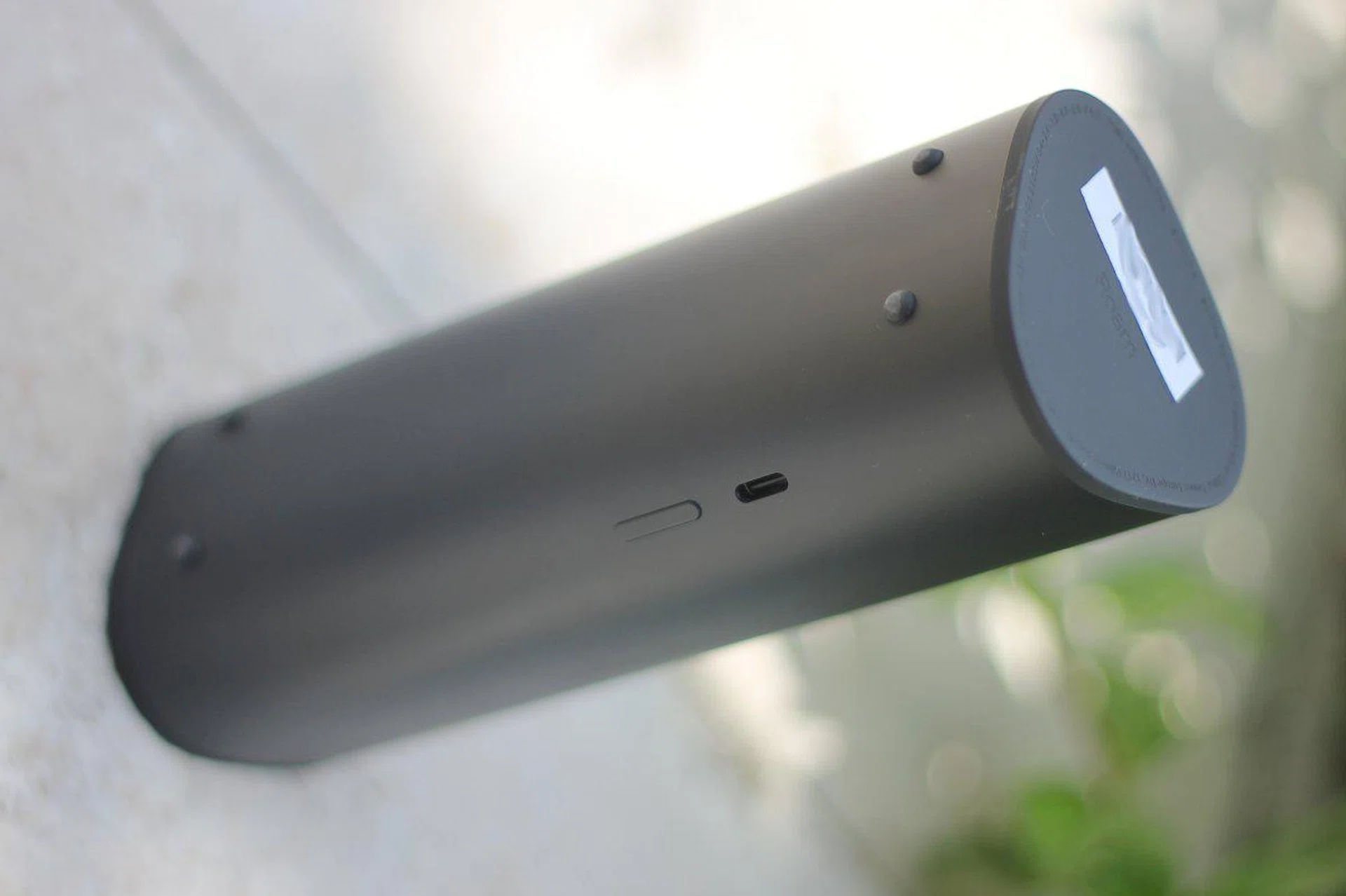 Note the charging port and the power button on the rear of its body.