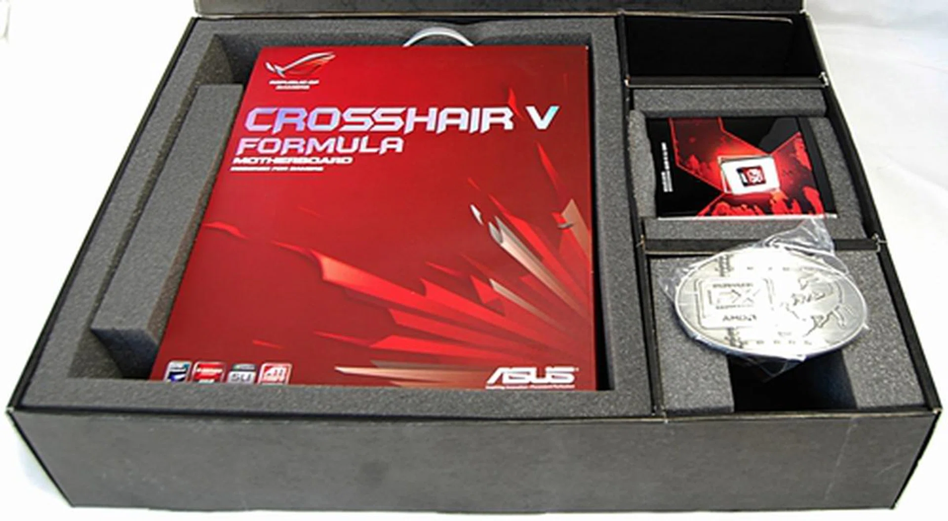 Revealing the contents of the press kit, which are tightly packed in their own foam-lined compartments.