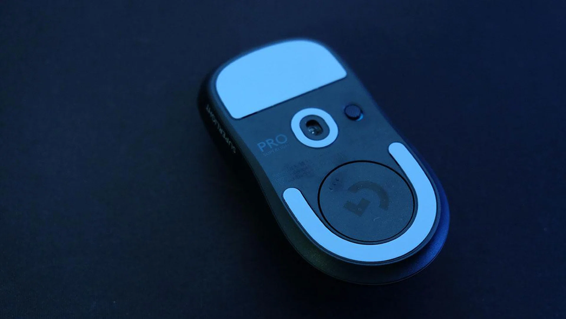 The dongle is stored in a niche at the bottom of the mouse. 