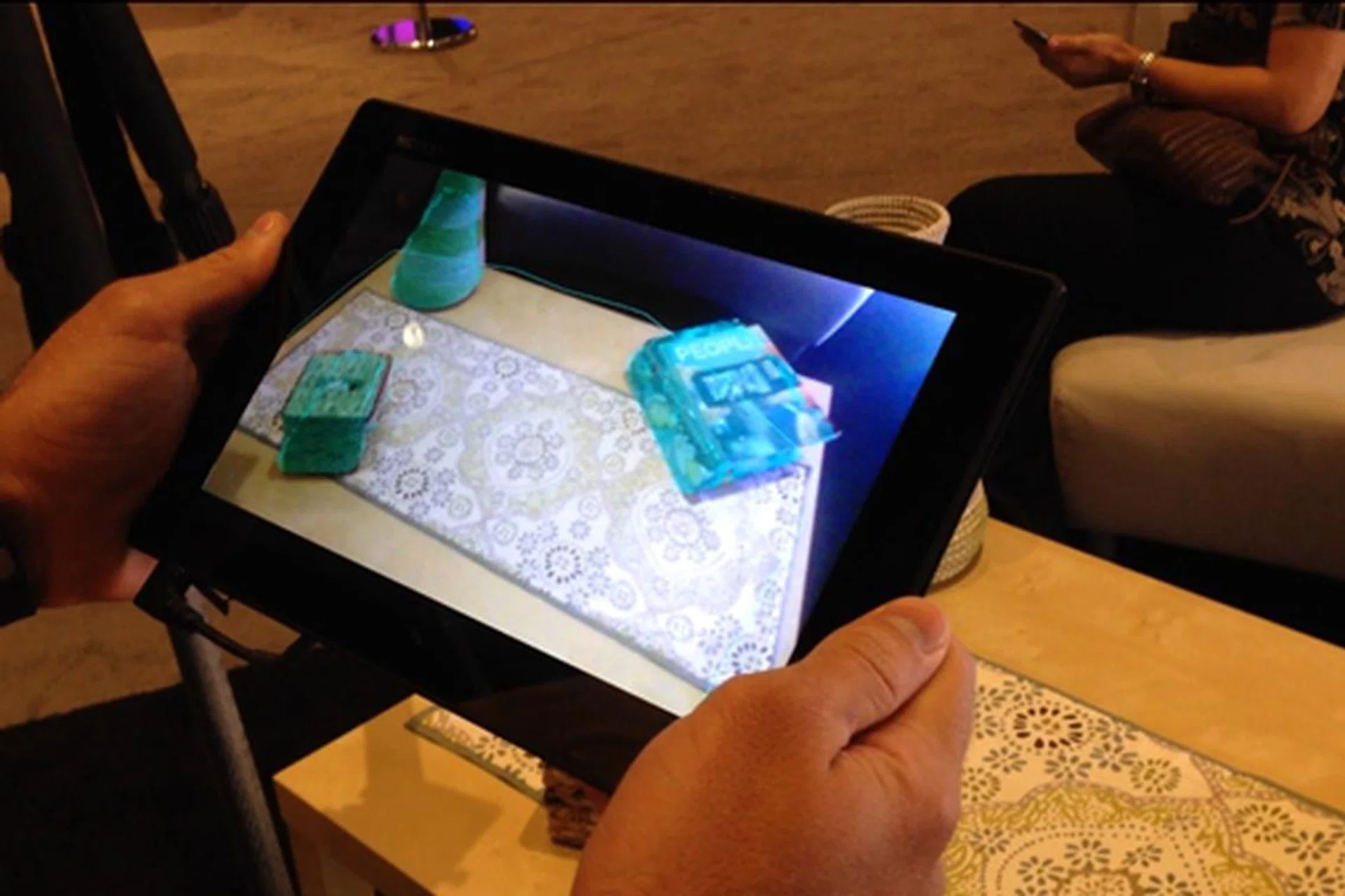 Qualcomm used a Sony Xperia Tablet Z to demonstrate how its new augmented reality technology allows you to play games on the go.