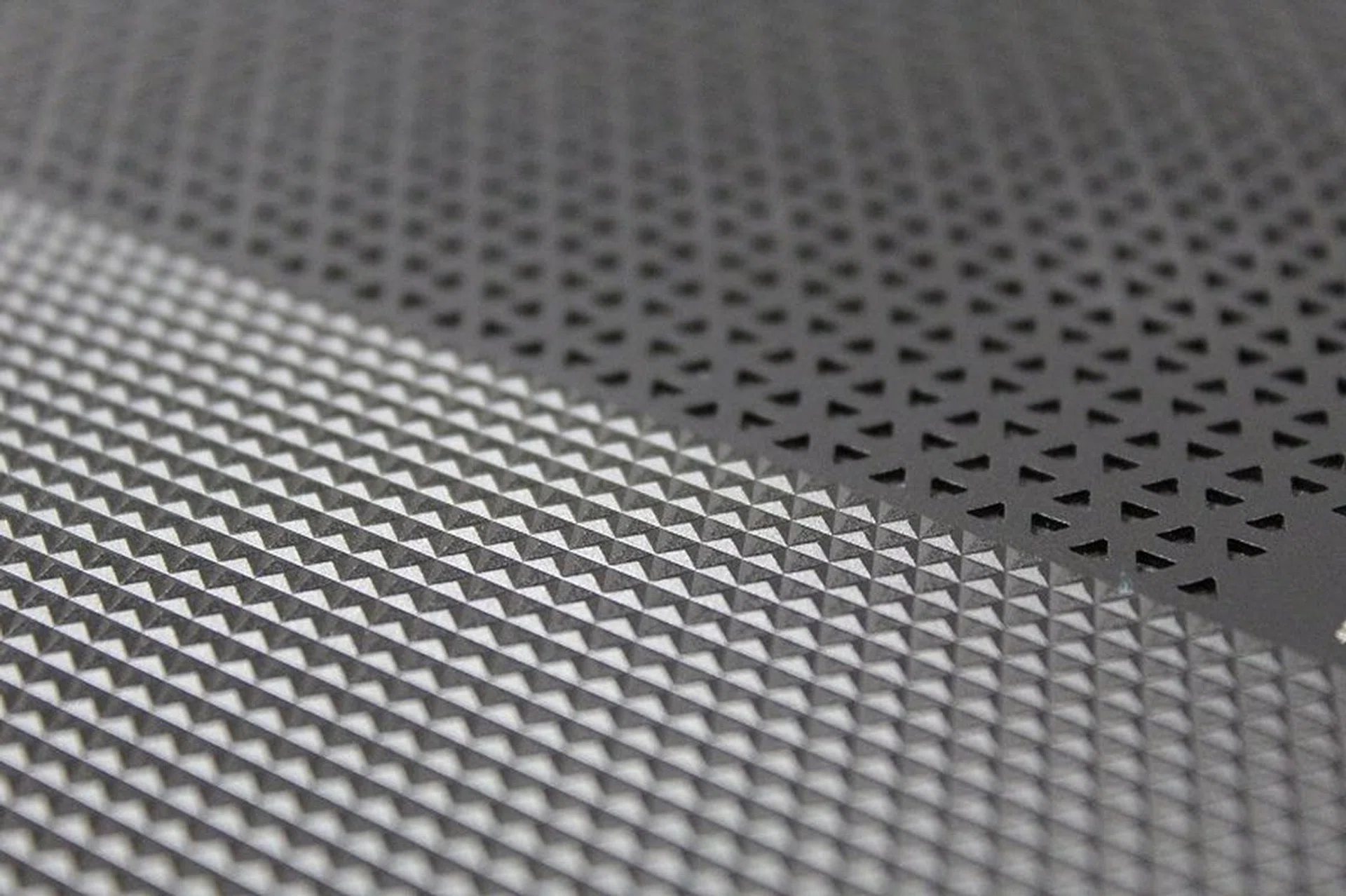 A close-up of the textured chassis. This shot is taken from underside of the notebook, near the middle.