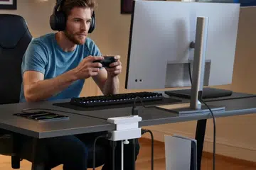 The Anker Nano Power Strip powering up the gaming setup.