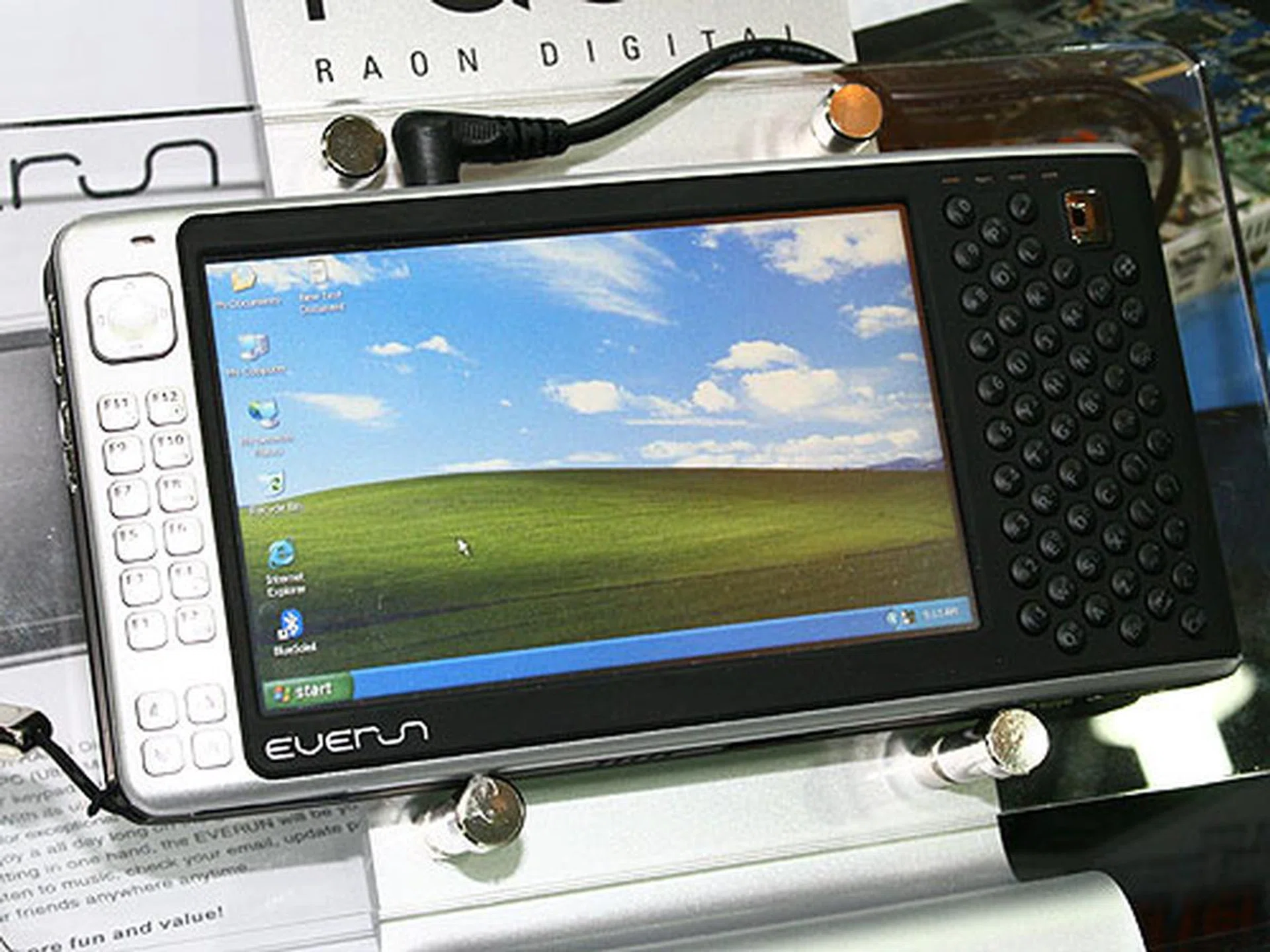  This cool UMPC from Raon Digital uses an AMD Geode LX 900 processor clocked at 600MHz. The device weighs no more than 500g and it runs Windows XP.  