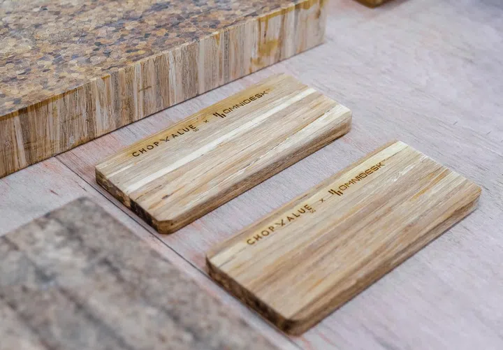 Tiles of processed and compressed tiles made from wood chopsticks get turned into tabletops. (Image source: Omnidesk)