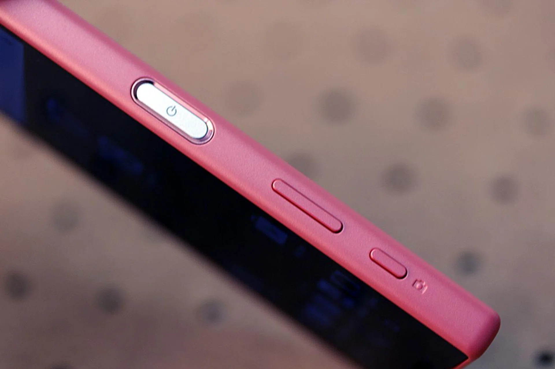 Oblong-shaped power button sits inside the rim, unlike older Xperia flagships where it's raised above the phone's profile.