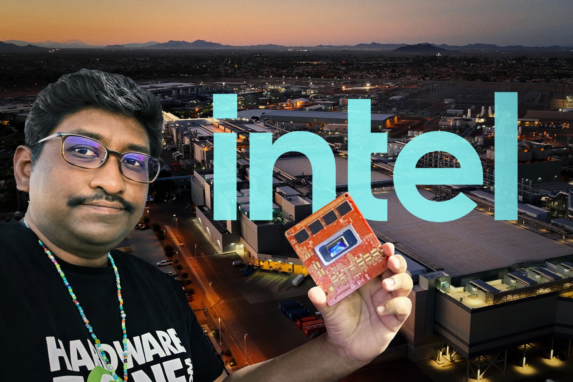 Editor-in-Chief of HWZ holding an Intel robotics platform based on the next-gen Intel Panther Lake with Intel Arizona’s Fab 52 in the background.