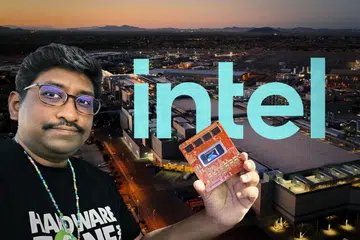 Editor-in-Chief of HWZ holding an Intel robotics platform based on the next-gen Intel Panther Lake with Intel Arizona’s Fab 52 in the background.