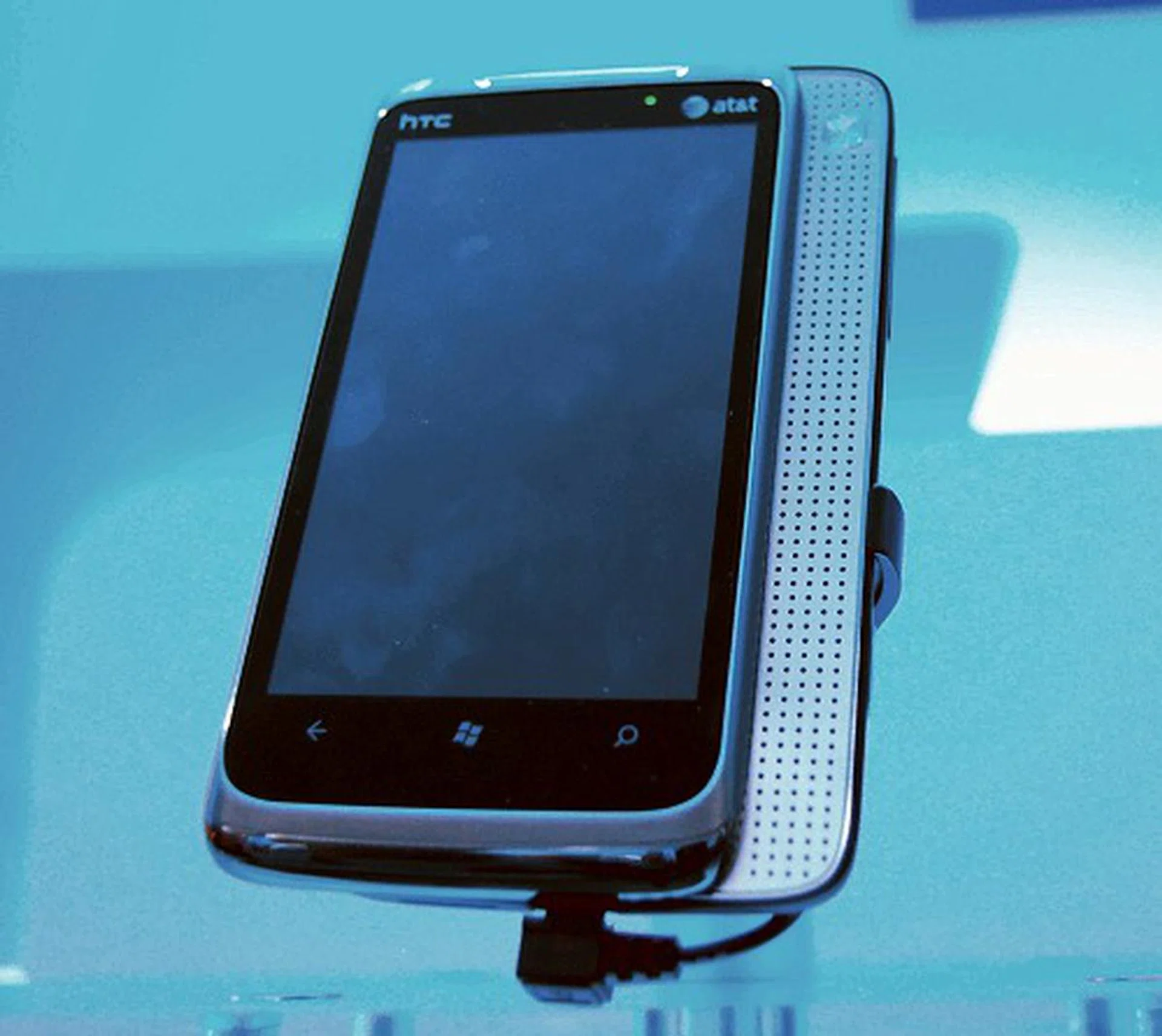 This is the HTC Surround based on the Windows Phone 7 OS and prominently features a slide-out speaker array (feels a bit stiff though) for virtual surround sound with Dolby Mobile and SRS WOW HD audio enhancement features. Other notable features include a kickstand for hands-free viewing and a Sound Enhancer App with equalizer presets. Screen size is 3.8 inches across and has a 480 x 800 pixels (WVGA) resolution. Naturally, it uses a 1GHz processor, has 16GB internal storage and comes with a 5MP camera sensor.