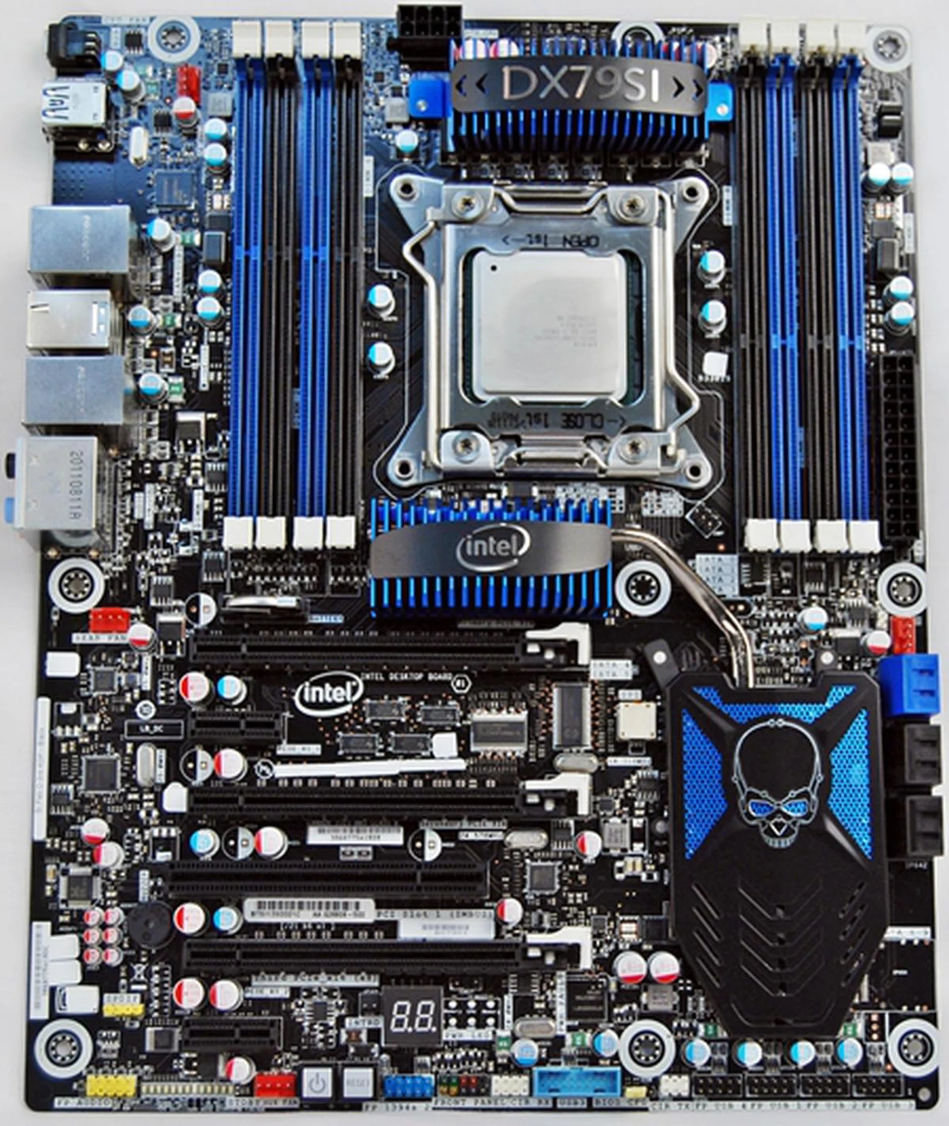 The Intel DX79SI Siler features eight DIMM slots and sports a blue-black color scheme that is similar to mainstream X79 motherboards from MSI, Gigabyte and ASUS. ASRock seems to be the exception for now as their X79 boards are decked out in opulent colors of gilded gold set against black PCBs.