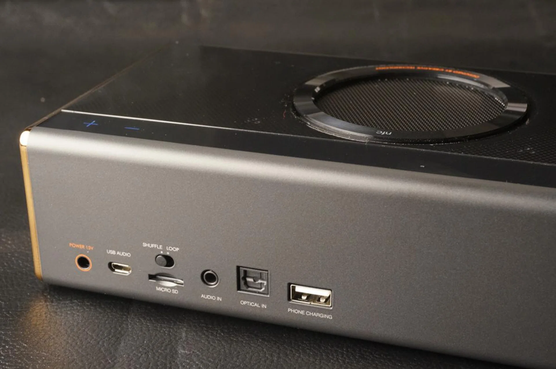All the needed ports are on the spine of the speaker. 