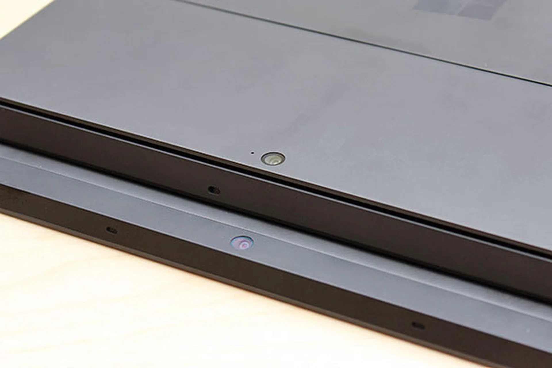Both the Surface Pro and Surface RT come with 720p front and rear-facing cameras. But did you notice that their rear-facing camera is angled upwards? This is to allow the camera to shoot straight ahead (instead of shooting at the floor) when the kickstand is used. Also, the slit that runs around the Surface Pro serves as an air vent for the two fans within.