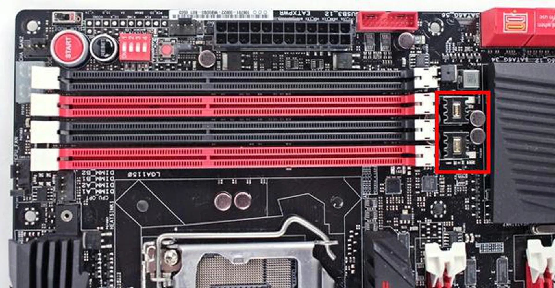The Blackwing chokes and the 10K black metallic capacitors, highlighted by the red frame, form part of the power delivery system for the DIMM slots.
