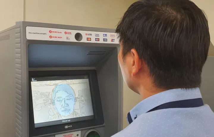 Remember not to smile if you didn't for your passport photo. Image courtesy of OCBC. 