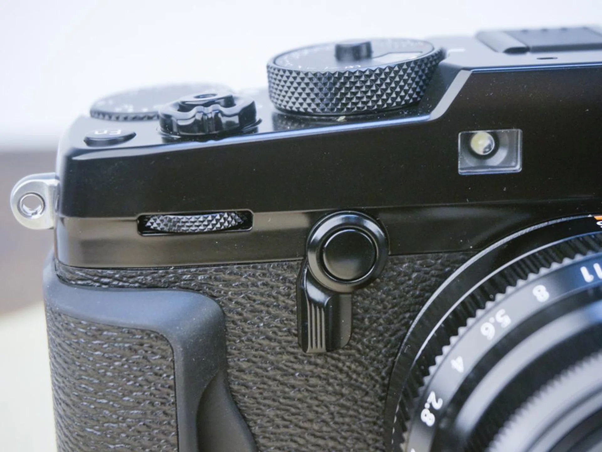 Flick the lever to change between OVF and EVF, or to toggle the extra EVF window.