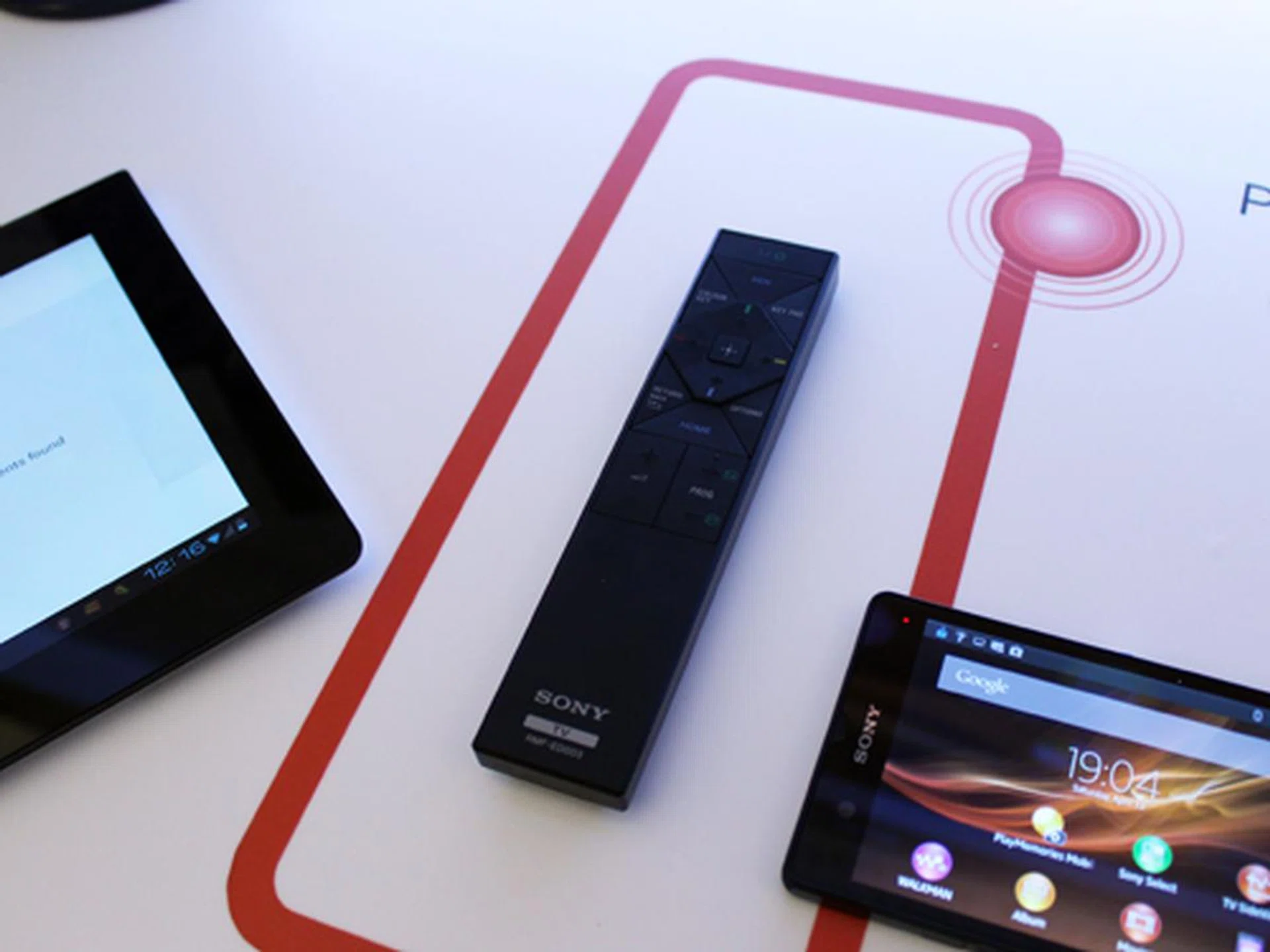 The new remote for the Bravia TVs is extremely thin and also allows for pairing with Xperia tablets and smartphones via NFC. This feature is called One Touch mirroring.