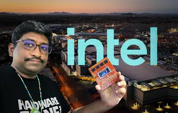 Editor-in-Chief of HWZ holding an Intel robotics platform based on the next-gen Intel Panther Lake with Intel Arizona’s Fab 52 in the background.