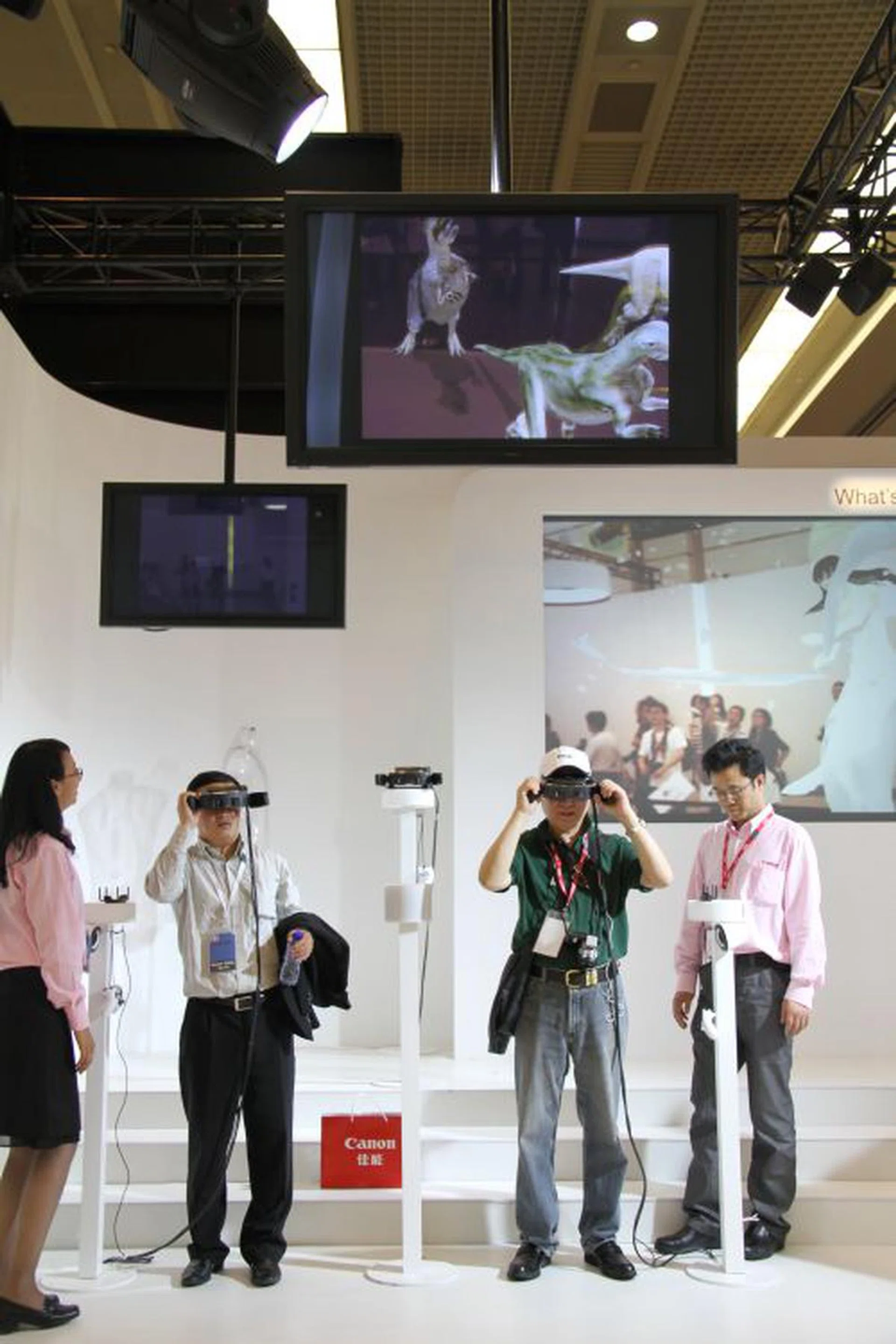Canon also showed its Mixed Reality plans (or experiment). Basically users put virtual reality head-mounted glasses and is able to interact with their immediate environments in a sort of an augmented reality world. The idea works for industries dealing in graphic design prototyping, virtual storyboarding, theme park entertainment, education and many more. Pictured here are visitors watching virtual dinosaurs running around in front of them.