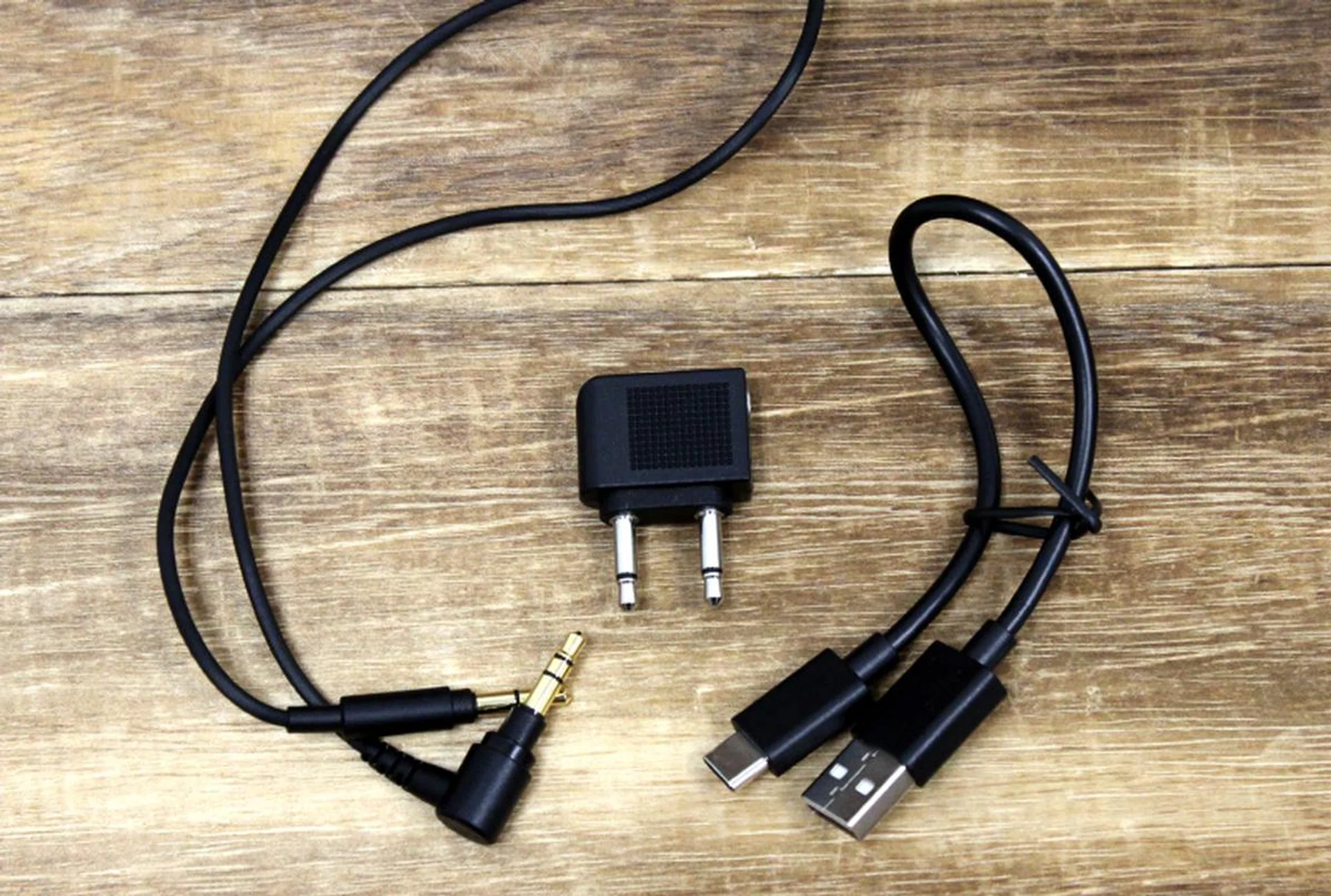The 1.2m cable, airline adapter, and USB-C charging cable that comes with the WH-1000XM3. The charging cable is a little short.
