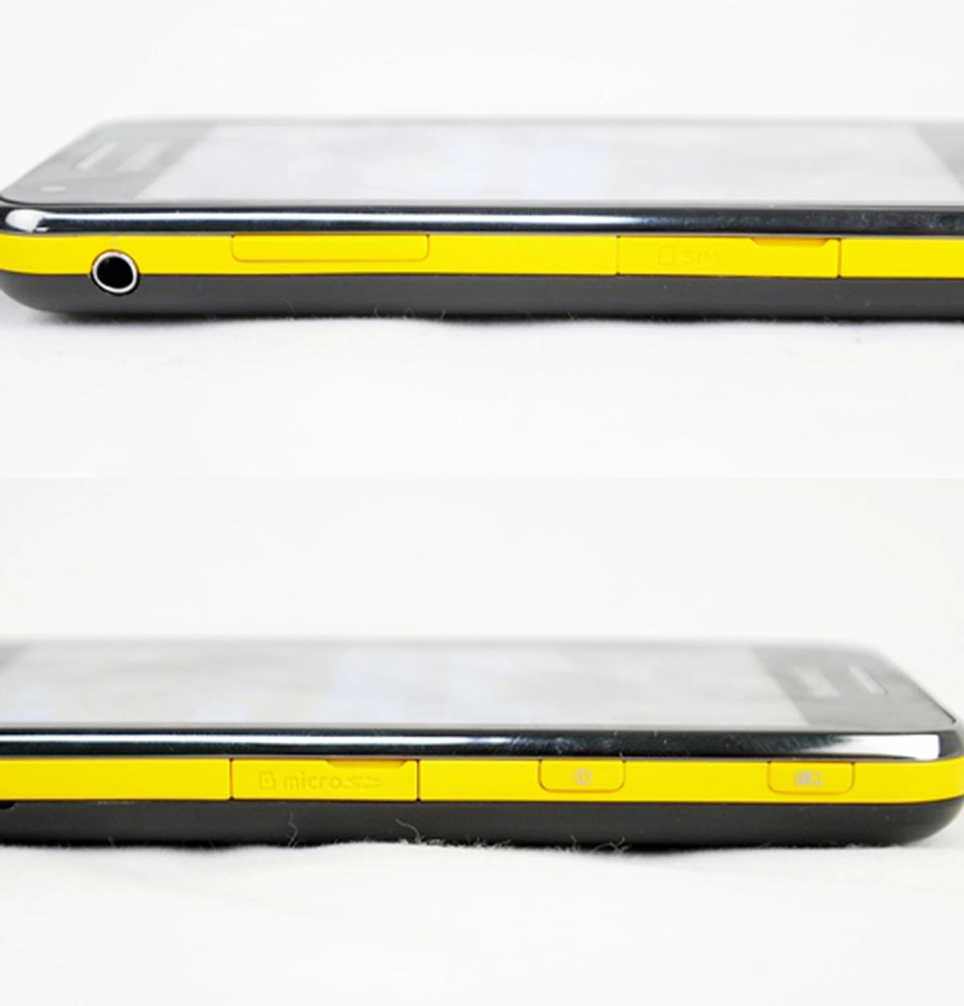 Card slots for SIM and microSD are each flanked on the left and right profiles (top and bottom photos respectively ), and are protected by plastic covers that are, thankfully, easy to remove. Spot the projector button at the top on the right side of the phone?