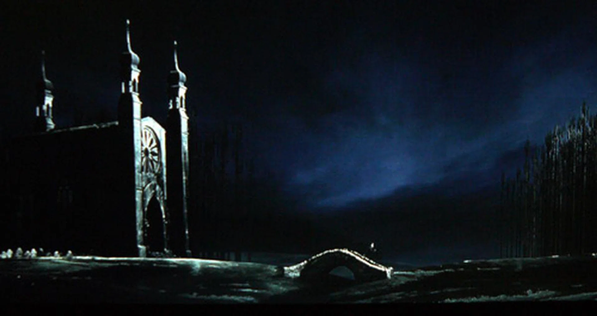 Here's a screenshot from Corpse Bride. Pay attention to the church located on the extreme left. Notice how its left portion almost blends in with the darker background? You can mitigate this by increasing the brightness and backlight values, but at the price of losing black levels to a very large extent.