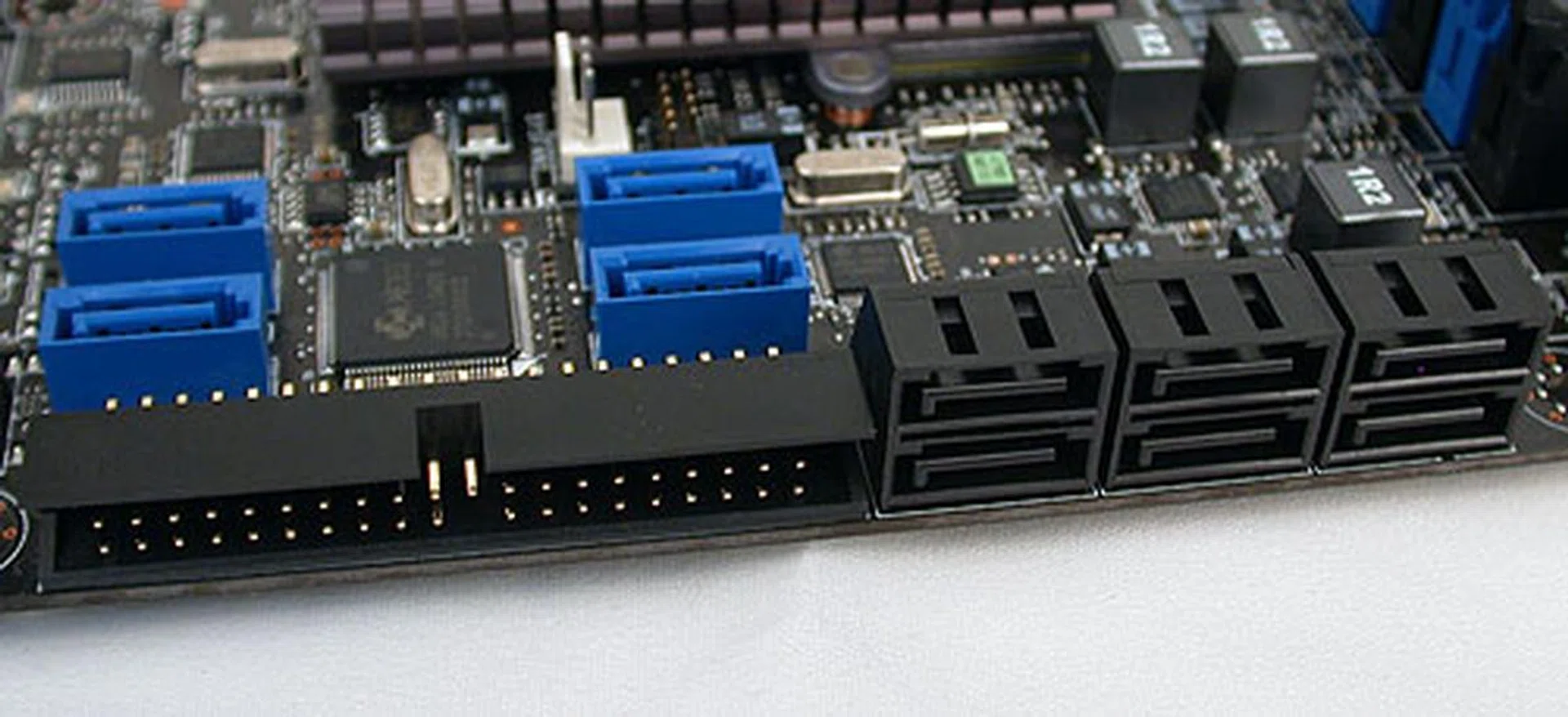 There are quite a large number of storage options on this board. First, the standard six SATA 3.0Gbps ports from the chipset. Then there are four more (in blue) SATA ports from a JMB322 controller and the IDE port from a JMB363 controller. Finally, the two eSATA/USB 2.0 combo ports at the rear panel due to a JMB362 controller.