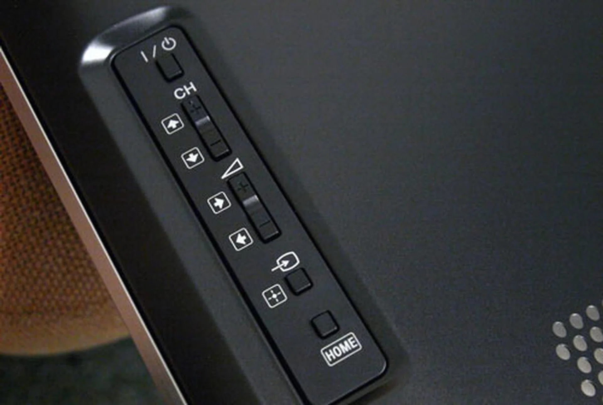 Like the HX925, the HX855 sports similar hardware controls located just behind the right side of the panel. A source selection and a Home button are located below the volume rocker switch.