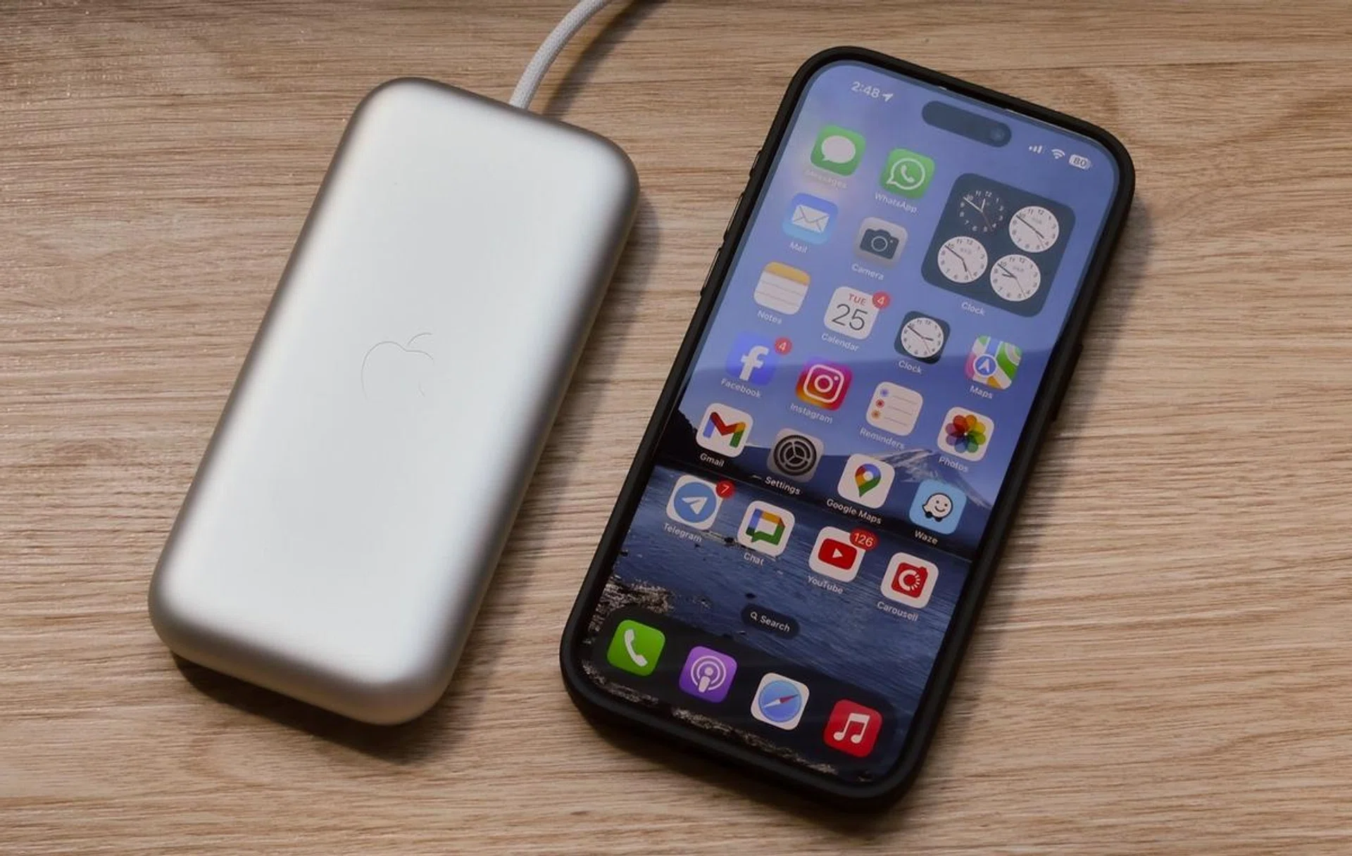 The battery is about the size of a 10,000mAh power bank. Here it is next to an iPhone 15 Pro Max.