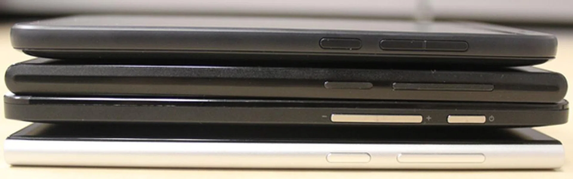 The right side view of the phones. <br>Top to bottom: HTC Desire 610, ZTE Blade VEC 4G, ASUS ZenFone 5 and Xiaomi Mi 3.