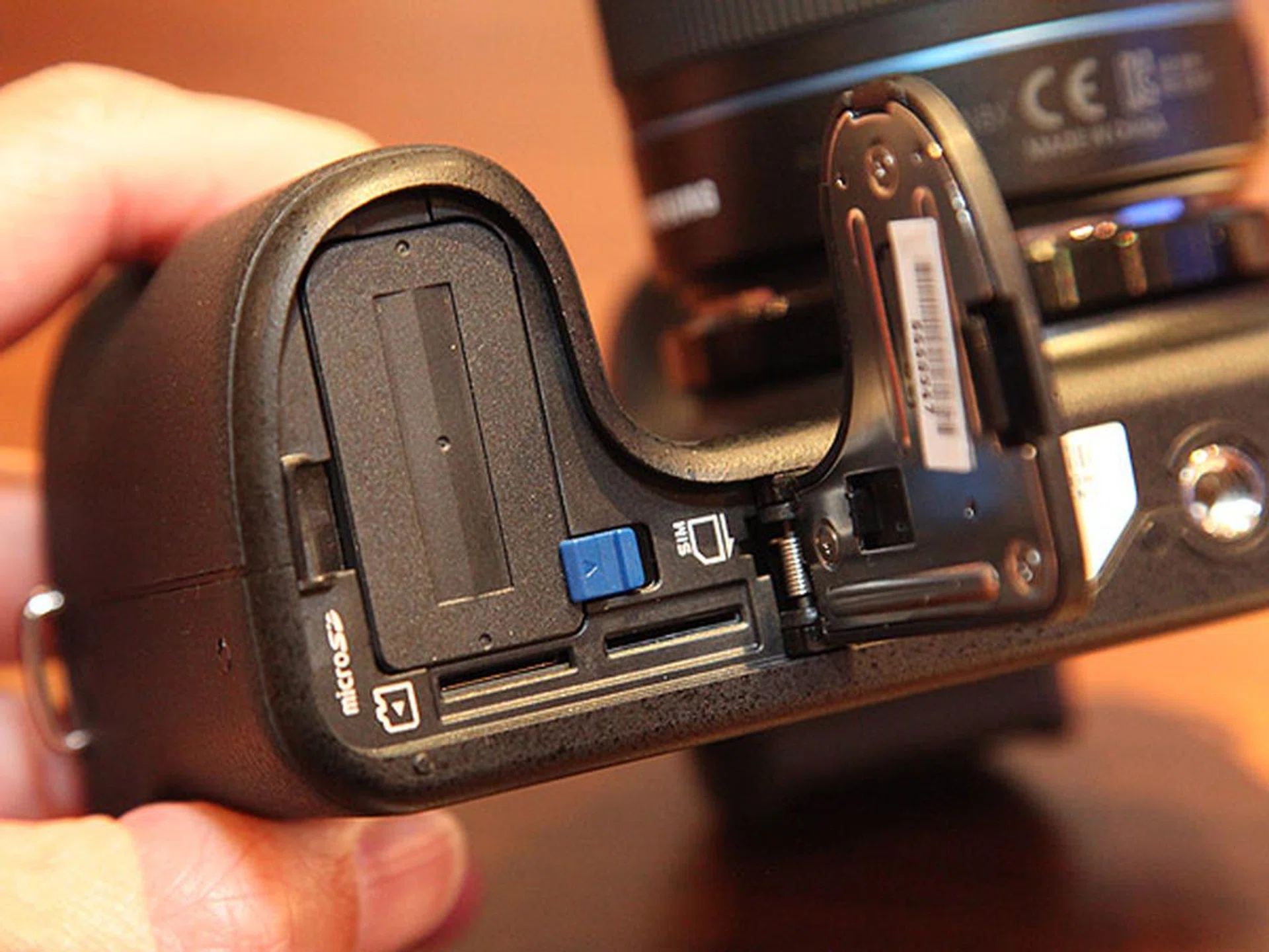 The battery compartment is where the microSD and micro-SIM card slots are located.