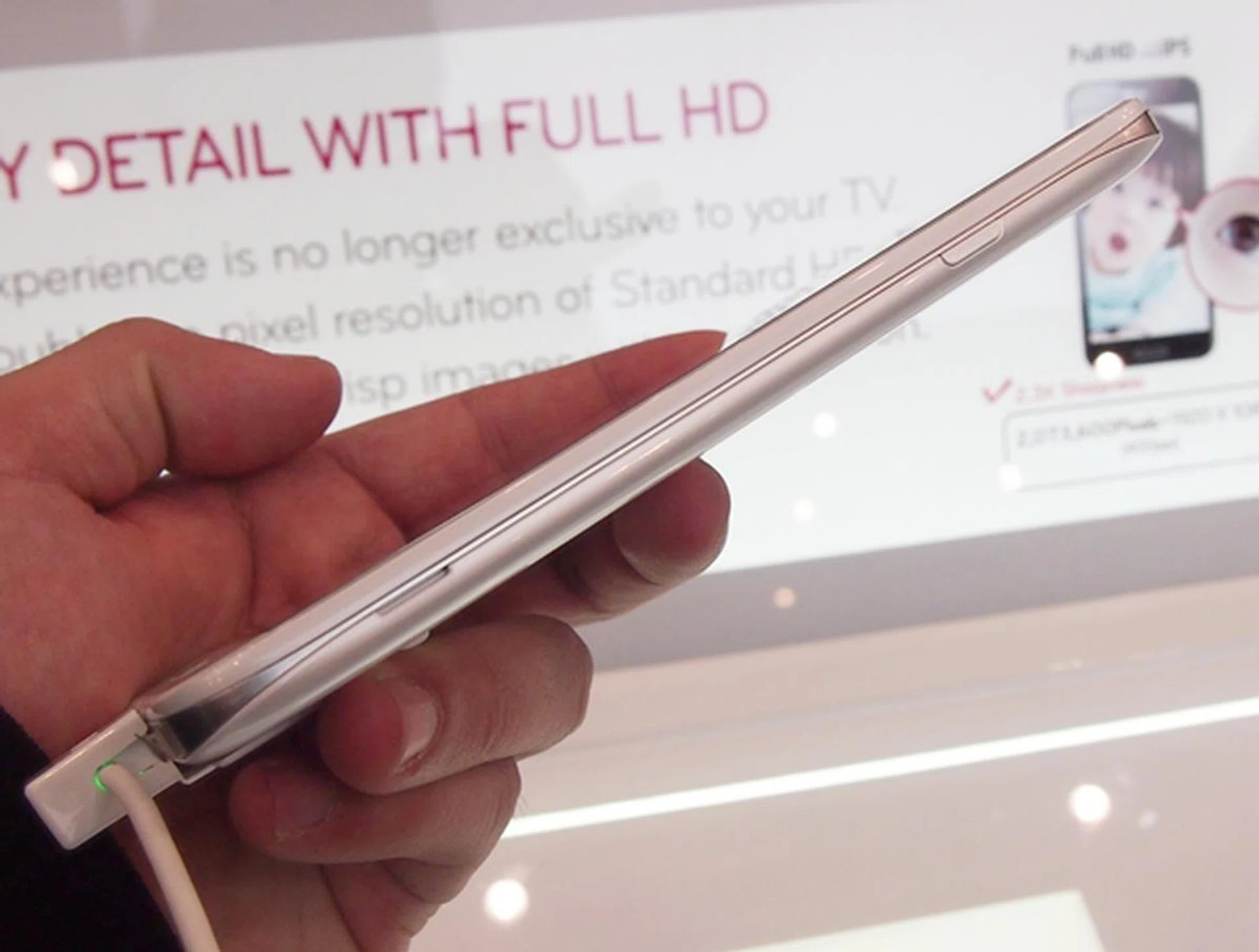 On the right side of the LG Optimus G Pro are the Power button a groove towards the bottom to assist you in removing the back cover.
