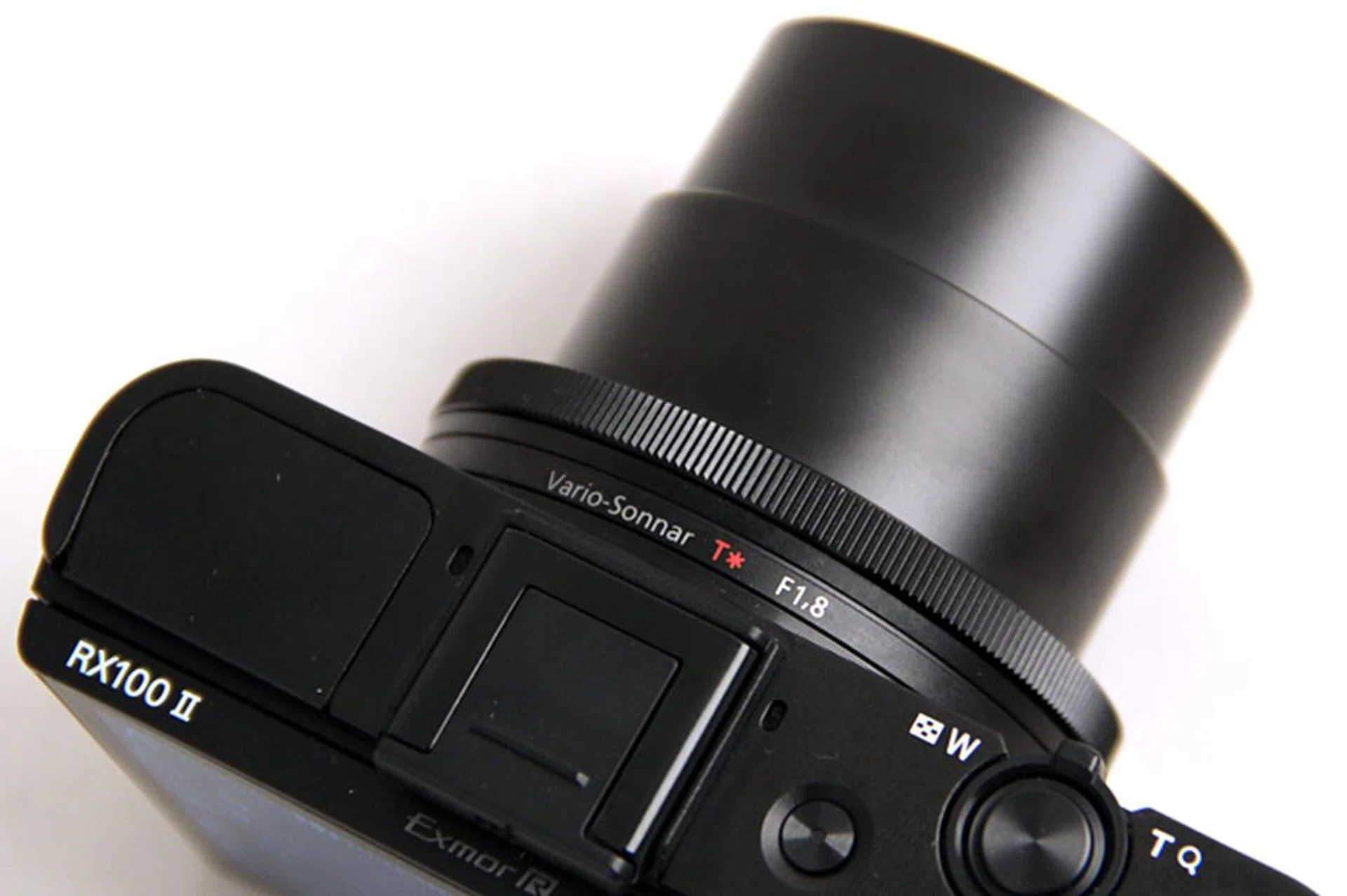 The control ring around the lens works like a DSLR camera's control dial, but it can also be customized to take over functions other than aperture and shutter speed control.