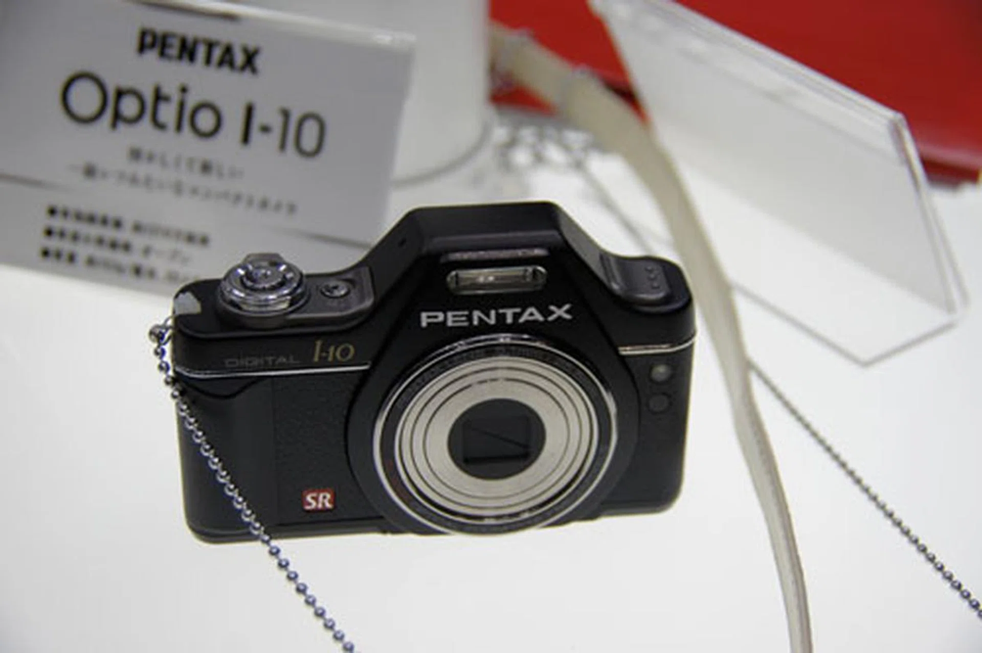 We love the uniquely-designed DSLR-ish Pentax Optio I-10 digital compact camera.