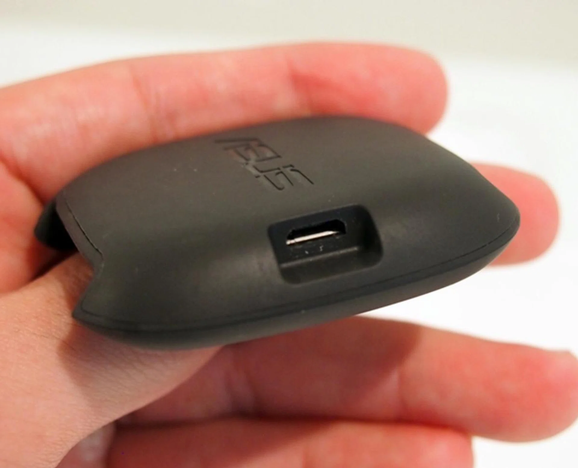 There is a micro-USB port at the side of the charging cradle.