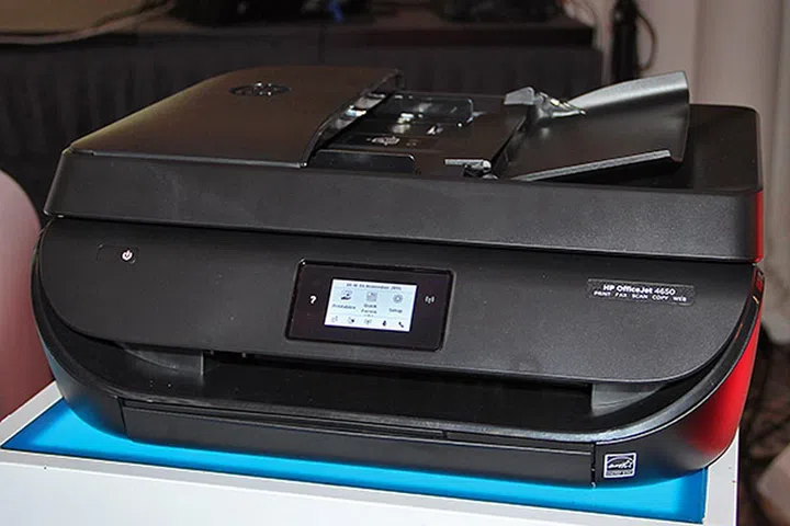 The HP OfficeJet 4650 AIO printer has fax functions and a built-in ADF.