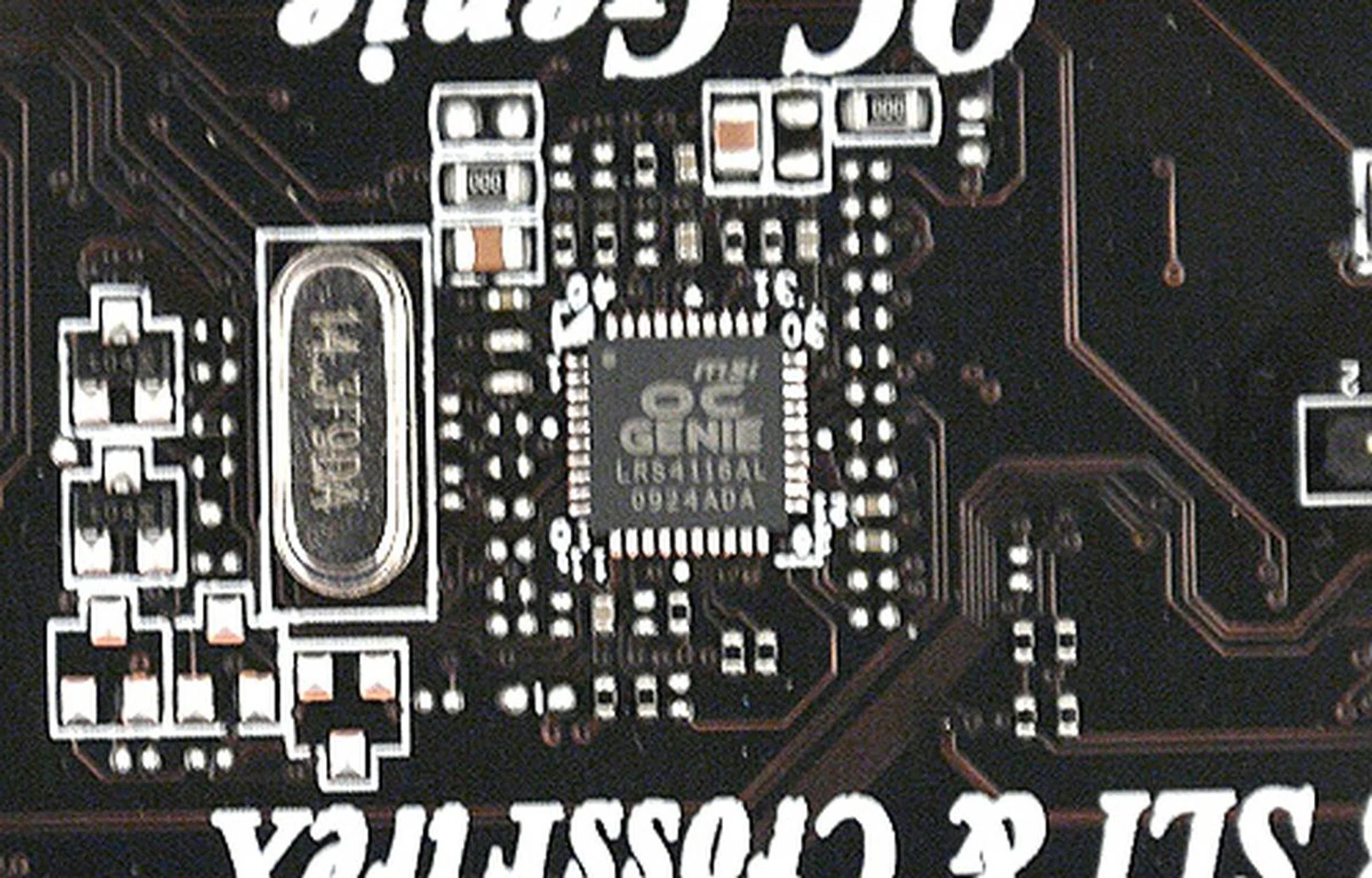 The magic of the OC Genie takes place here in this hardware controller IC dubbed as the OC Genie chip. It is located in-between the expansion slots, where the clock generators are normally found.