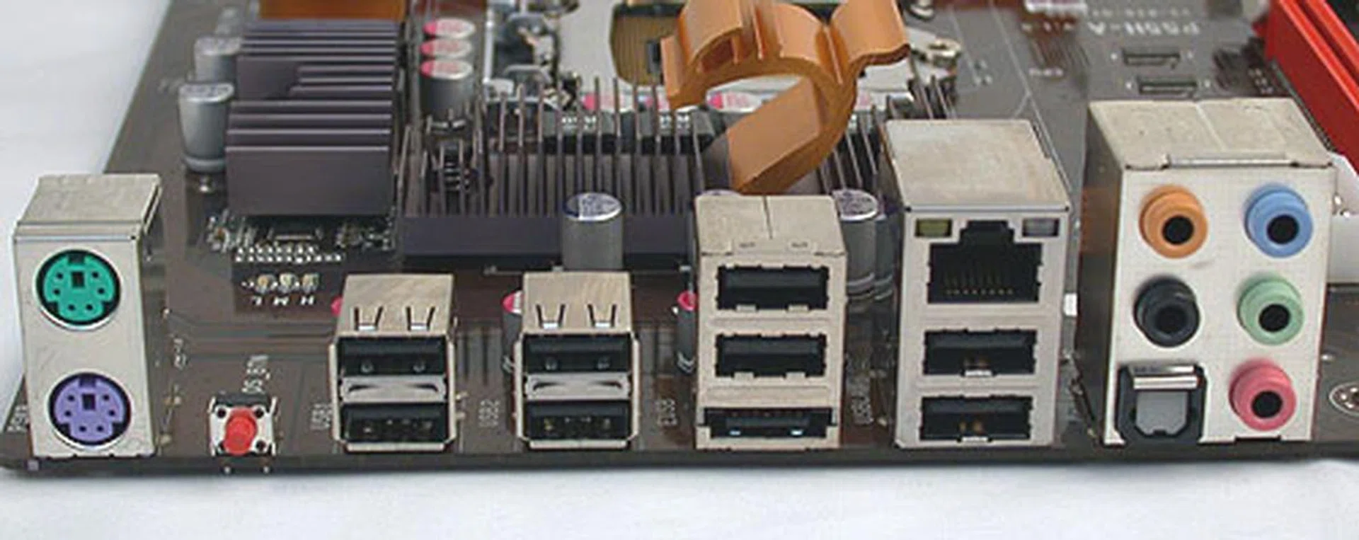 ECS kept with two PS/2 ports when most boards have ditched at least one. We're personally fine with that, since there are still eight USB ports here, along with the eSATA and Gigabit LAN ports. Optical S/PDIF is also found along with the standard audio jacks. The small red button here is the Clear CMOS switch.