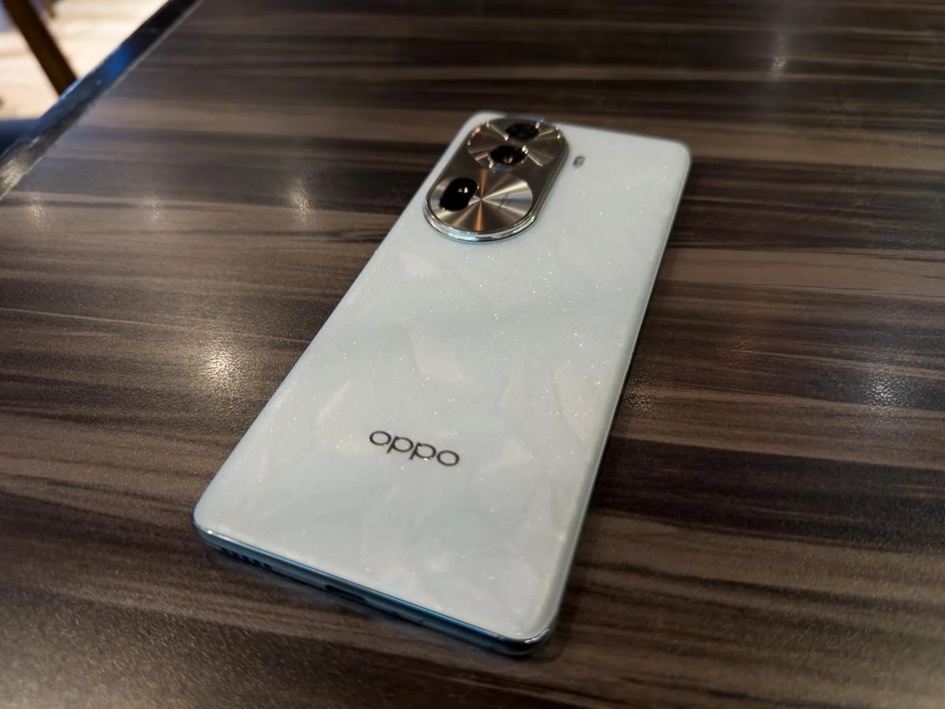 The shimmering specks are definitely visible under the right lighting conditions.