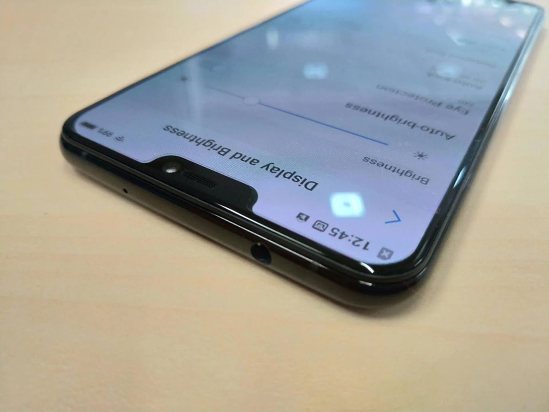 An ear speaker and the 12-megapixel, f/2.0 front-facing camera hide in a reasonably small notch.