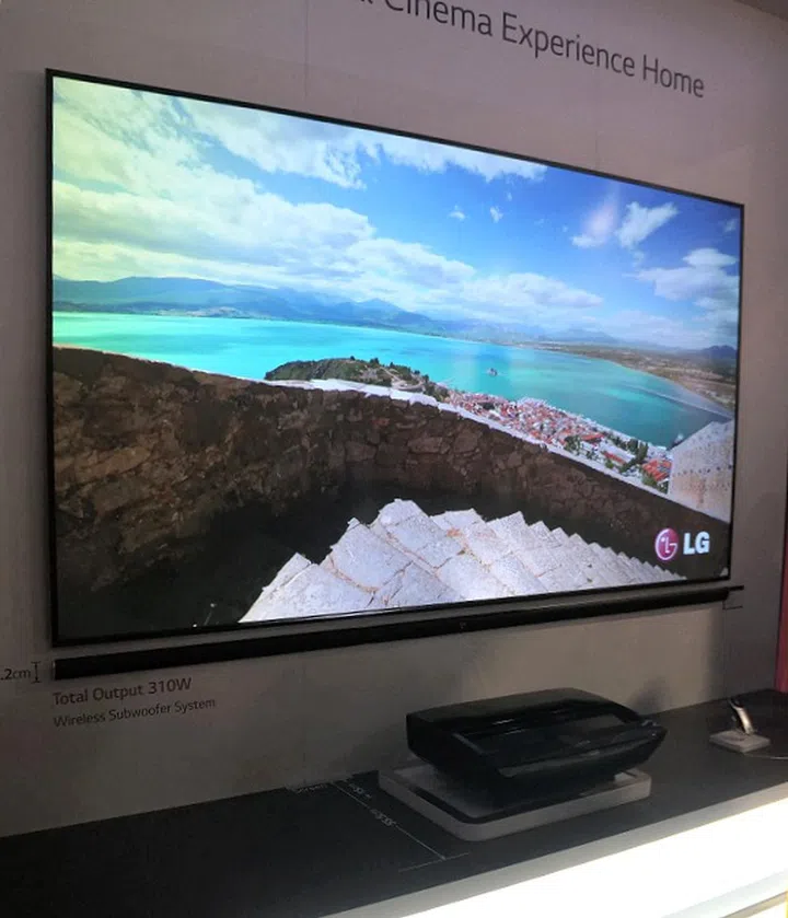 Here's the laser projection unit and the 100-inch screen at work.