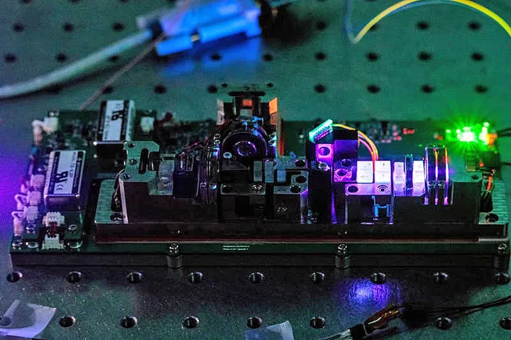 The instrument inside SpooQy-1 creates pairs of entangled light particles. Such light can be harnessed for secure communication. (Image source: Center for Quantum Technologies, National University of Singapore)